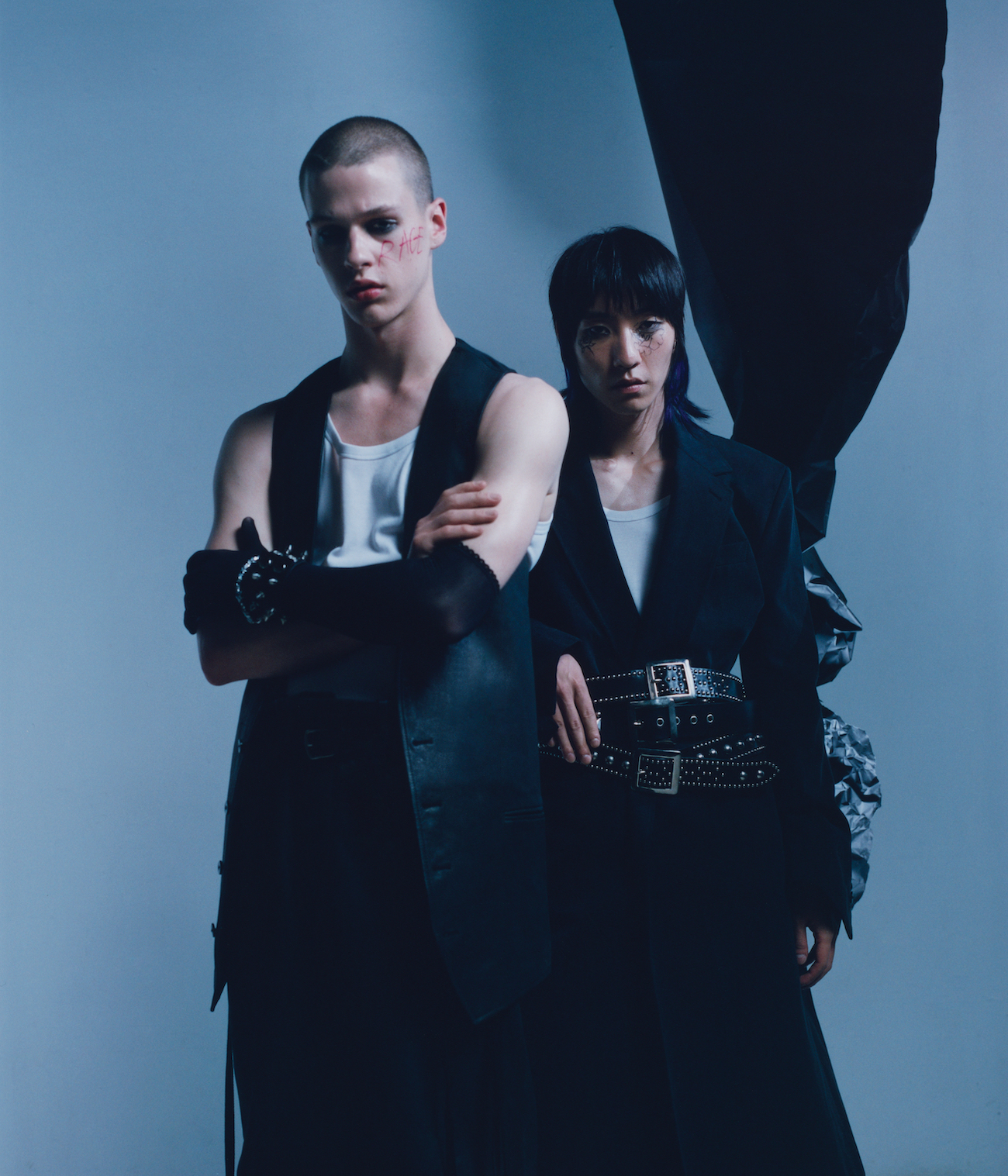 Left: All by ANN DEMEULEMEESTER, bracelet by SWEET LIME JUICE, leather armband by THE LONDON LEATHERMAN. Right: All by ANN DEMEULEMEESTER, belts by THE LONDON LEATHERMAN