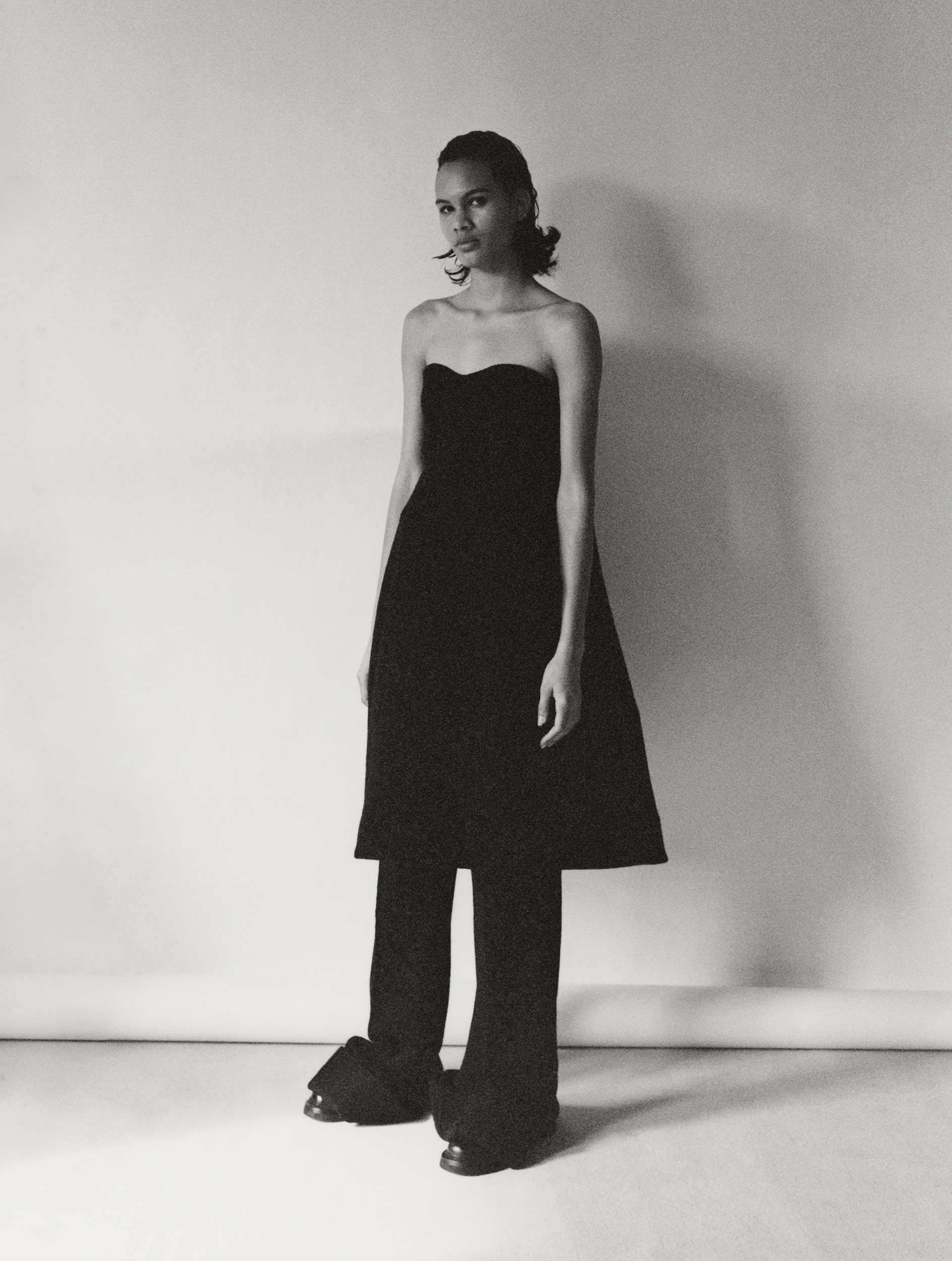 Lina wears dress and trousers by TOGA, shoes by NEW STANDARD