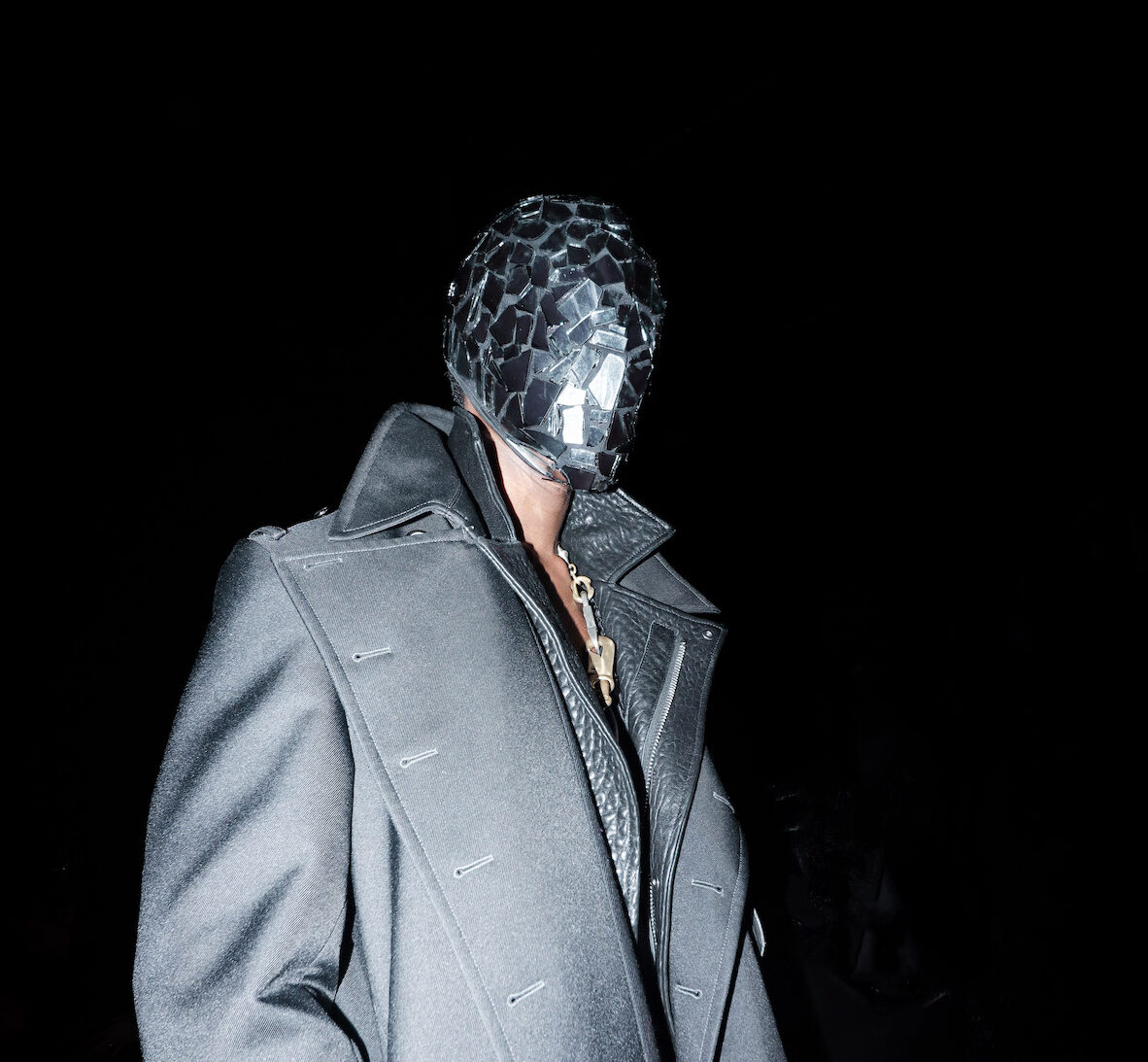 LuvAnthony is pushed down the runway in a glass box for Phenotype by The Radar at New York Fashion Week