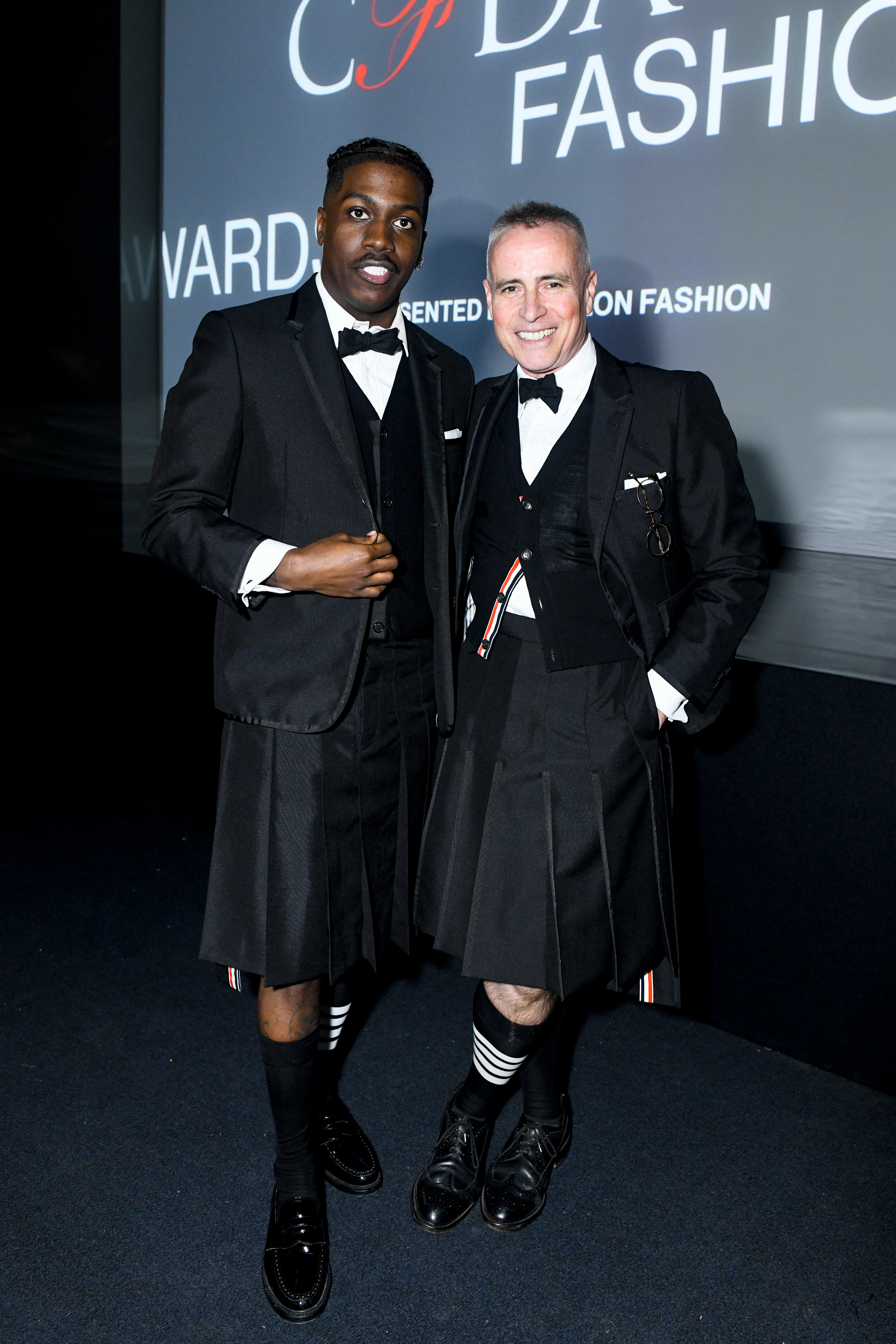Fashion icons unite: Rapper Lil Yachty and designer Thom Browne showcase unique styles at the CFDA 2023 Awards.