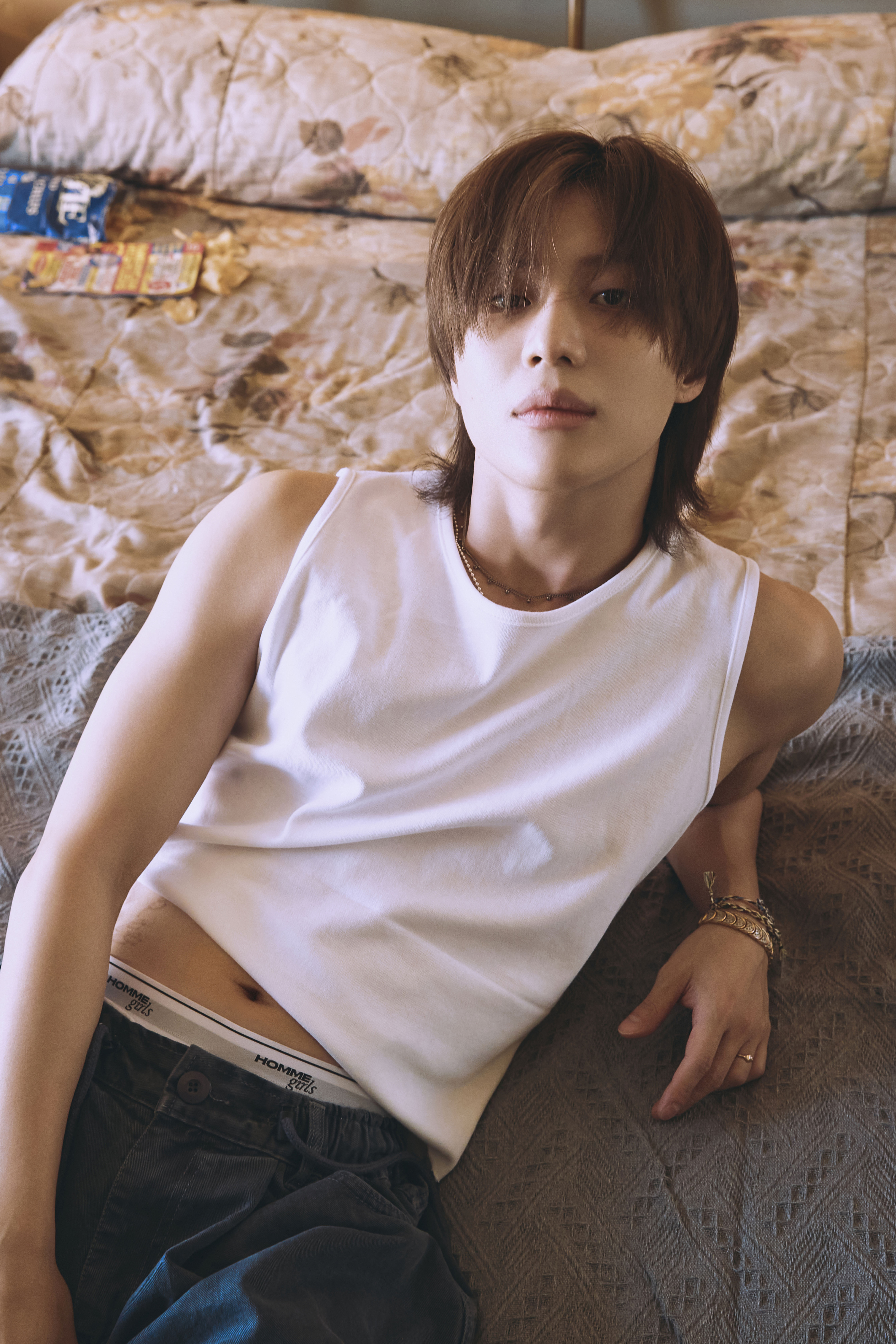 TAEMIN, the K-Pop sensation behind the latest mini-album 'Guilty', in a contemplative moment.