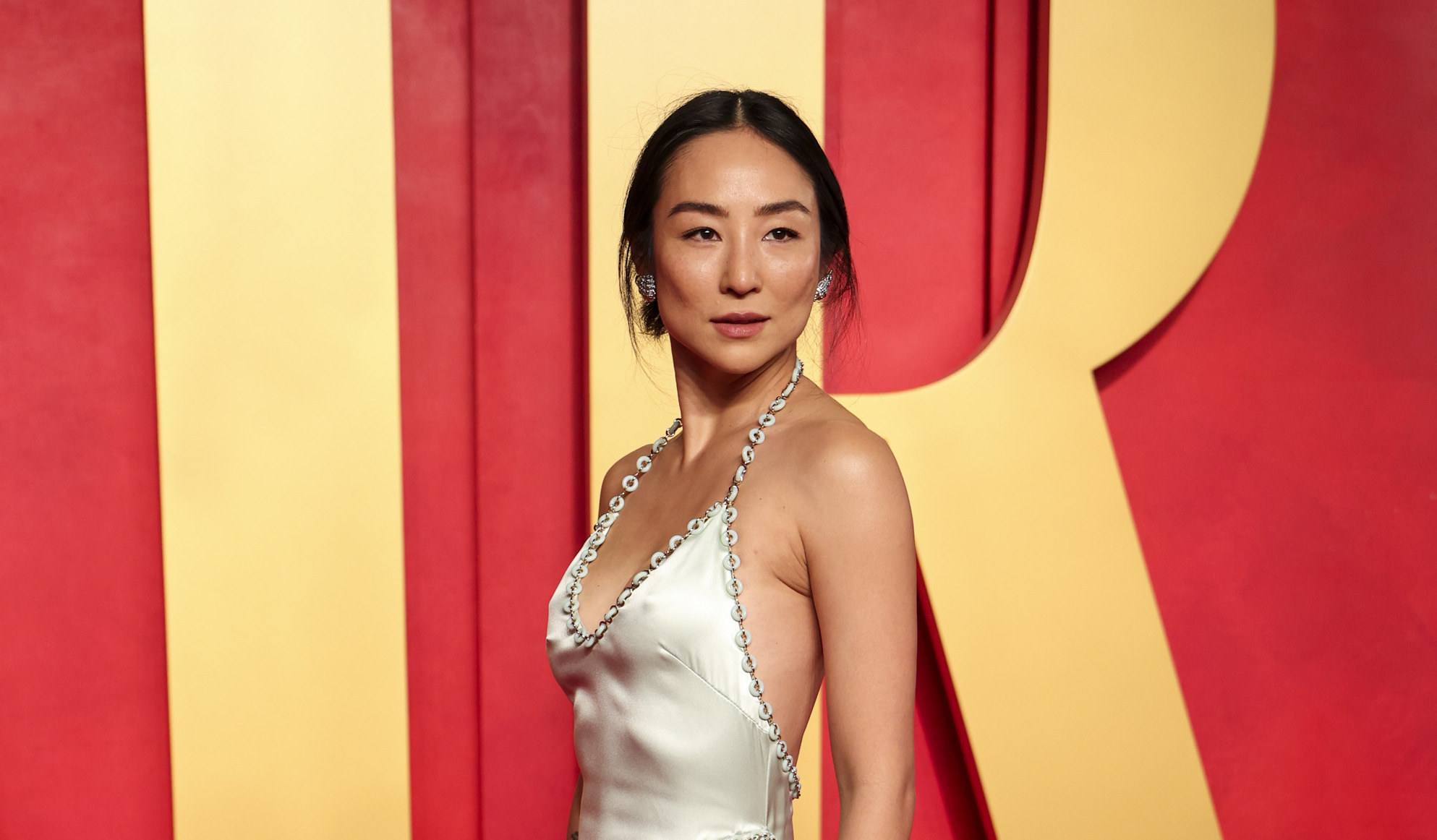 Greta Lee Stuns in Custom LOEWE Silk Gown at Vanity Fair’s 2024 Oscar Party